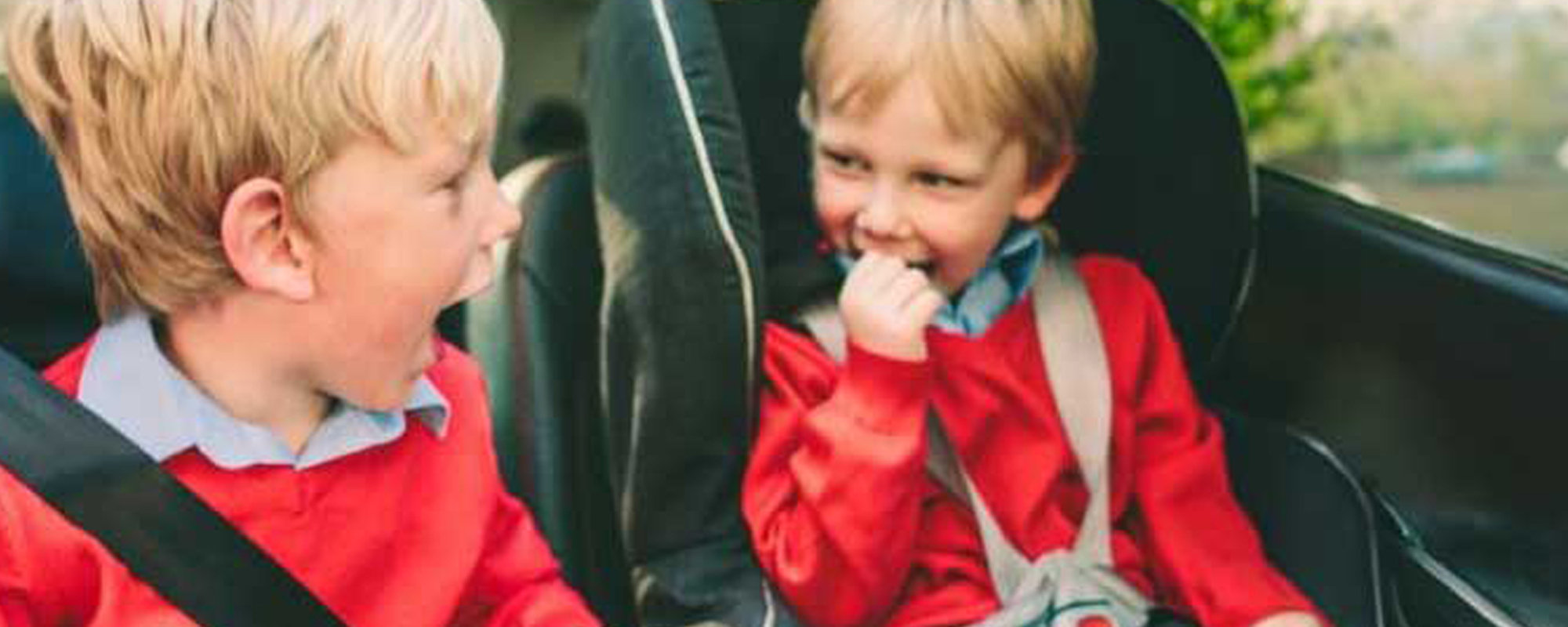 Two children sat in the back of the car