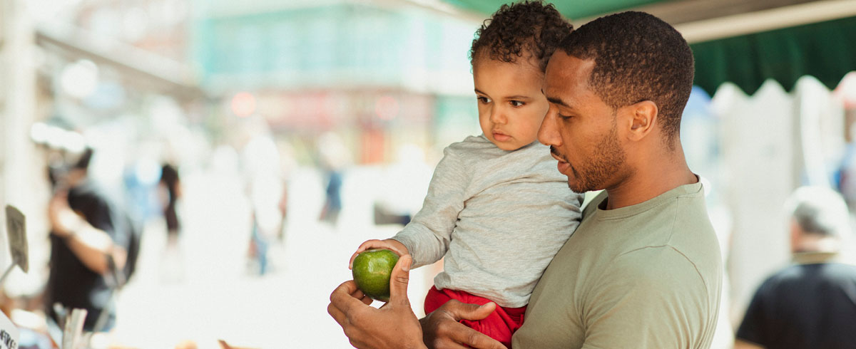 Father holding young child