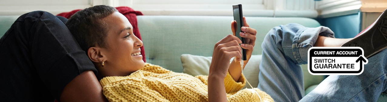 Two women looking at a mobile phone