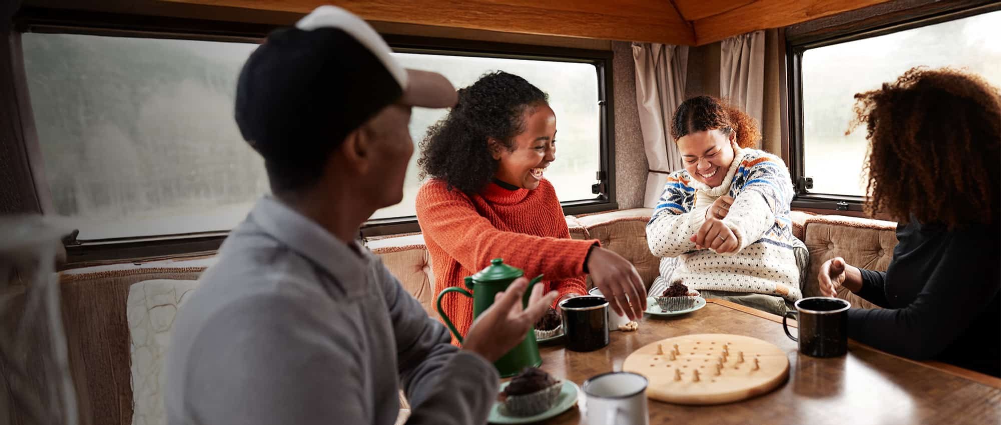 People playing a board game and laughing