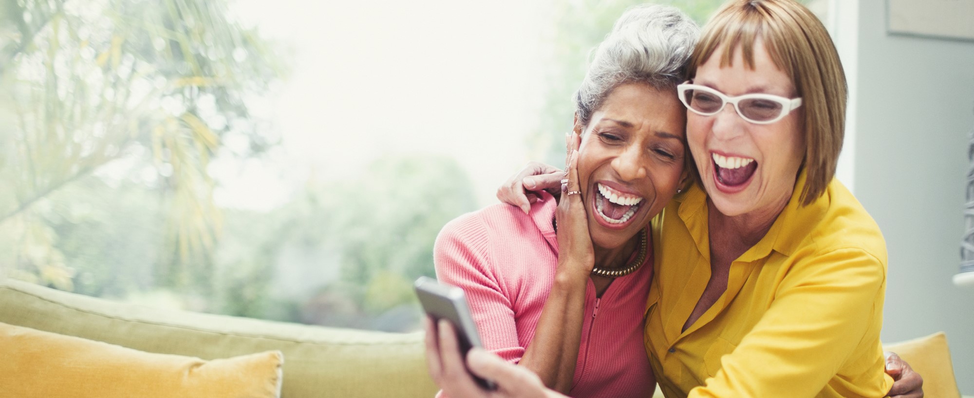 Two elderly people smiling.